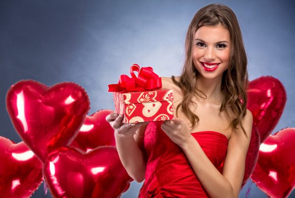 smiling girl  with a Valentines gift